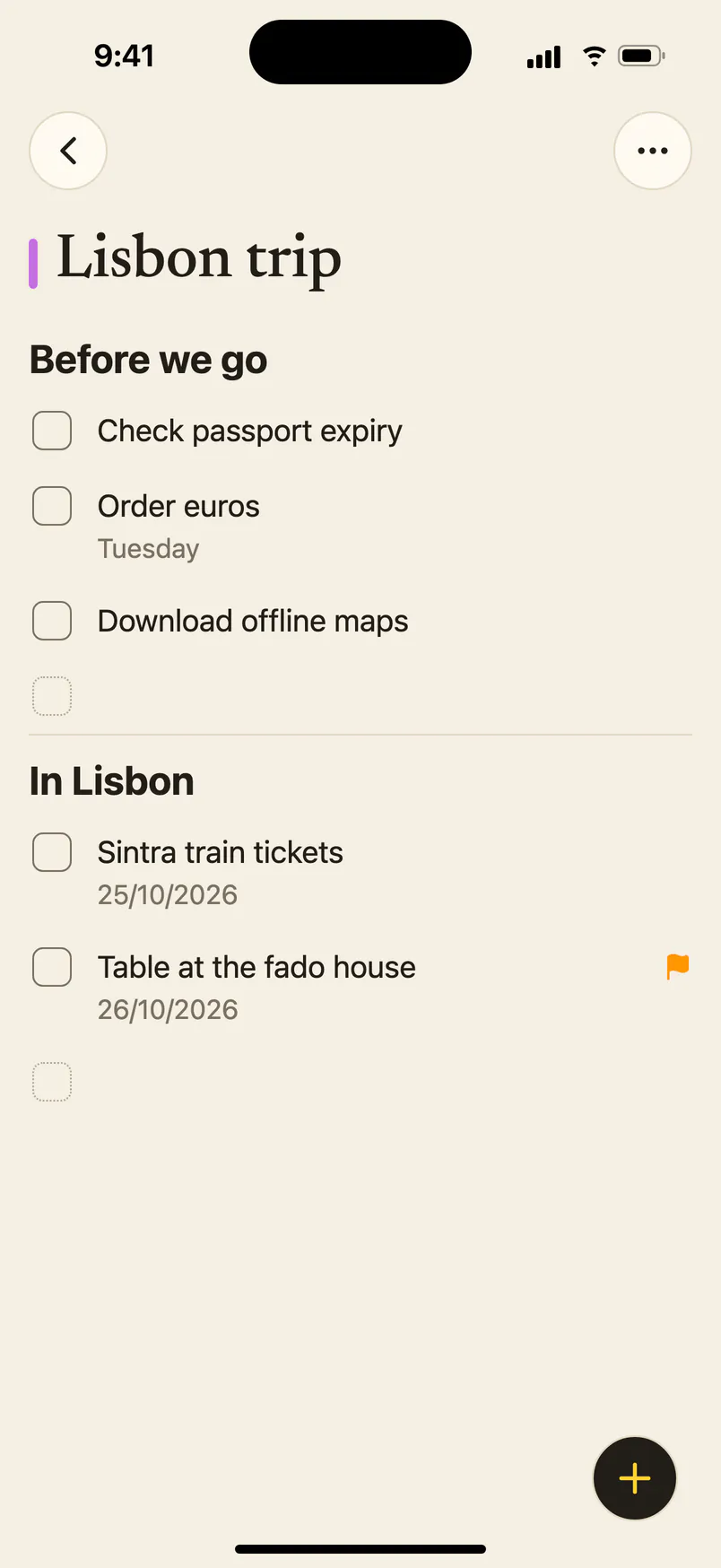 A purple reminders list called Lisbon trip on iPhone, in two sections: Before we go and In Lisbon.